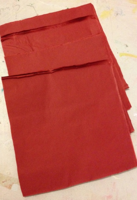 Cut your tissue paper into a stack of squares
